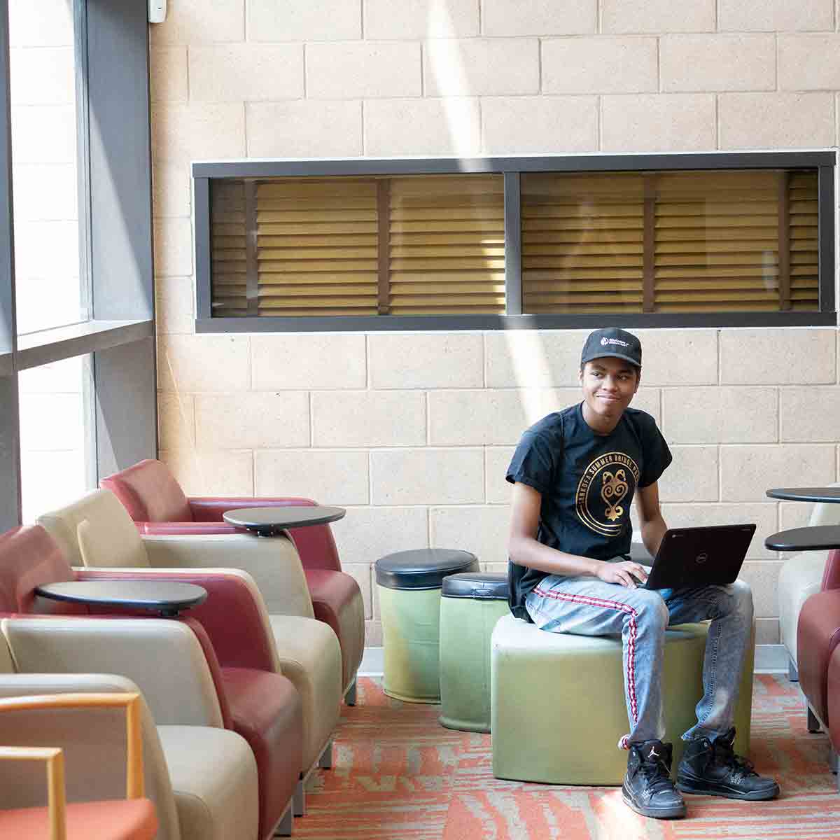 Student on laptop in study area