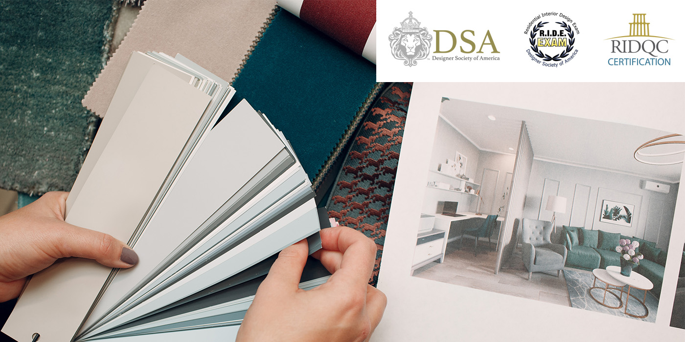A person holding out color swatches for interior design