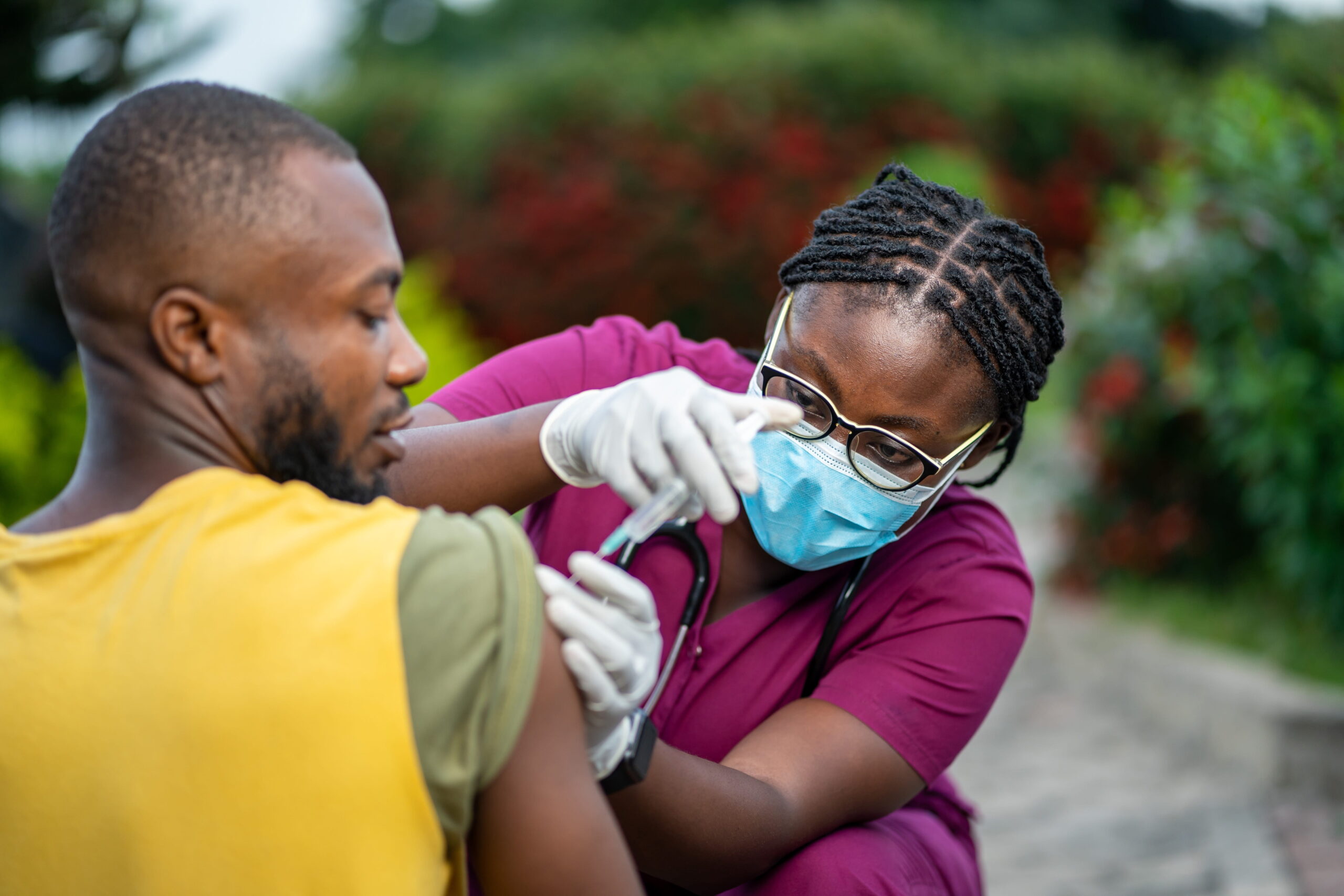 what_can_you_do_with_a_bsn-min2 Registered nurse gives a vaccine injection to a patient in a community setting.