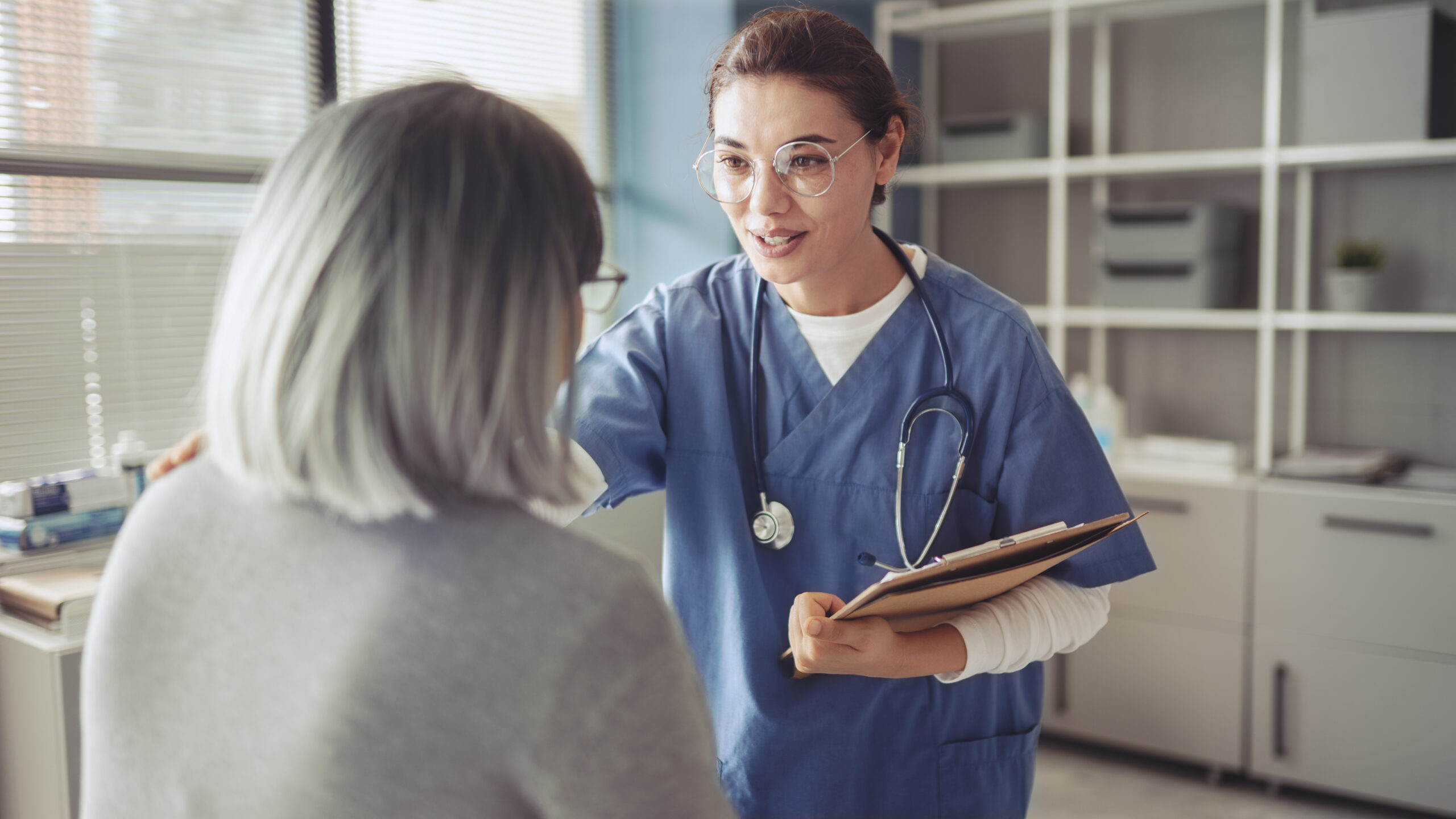 Healthy lifestyle and medical concept, the healthcare worker talks to the elderly patient and comforts her